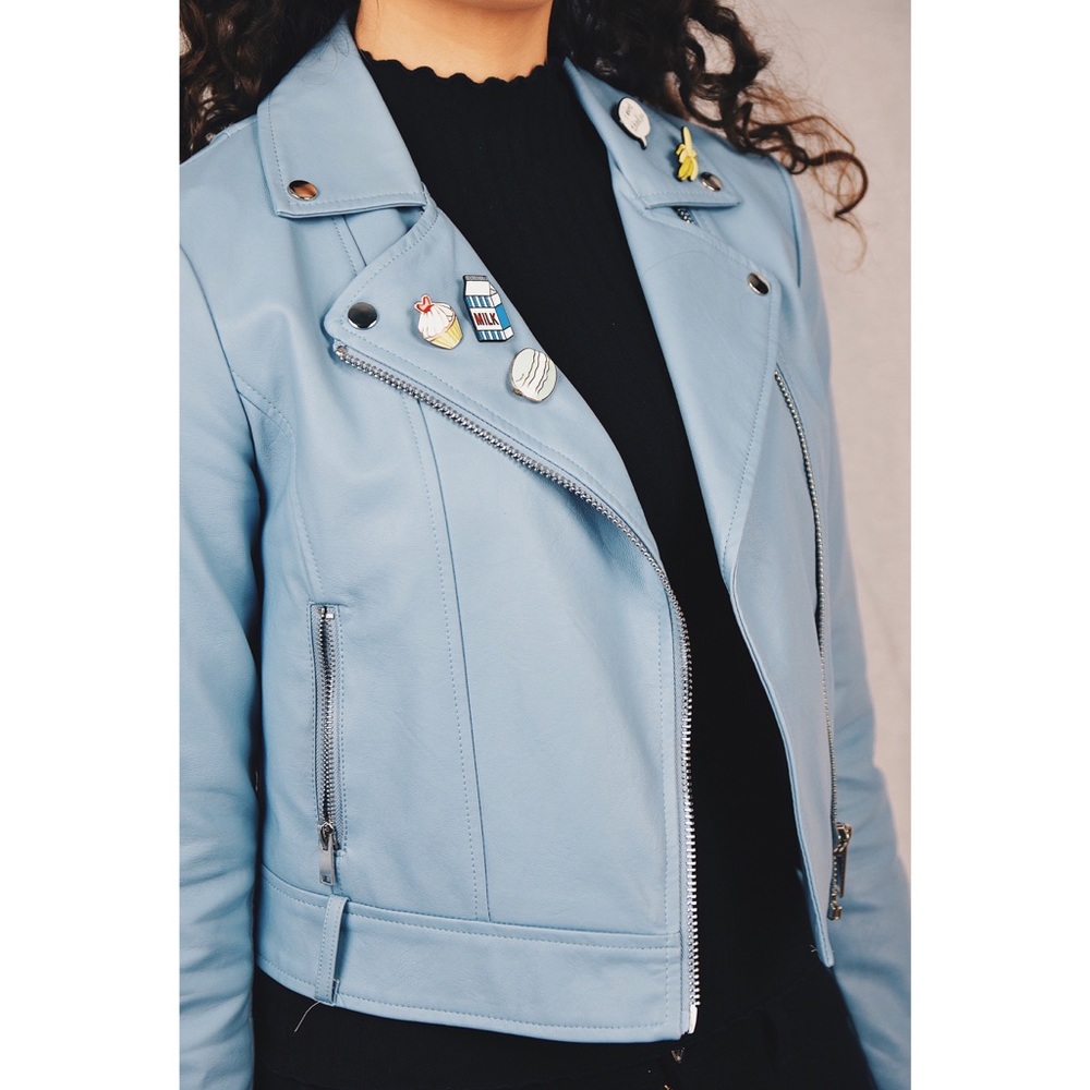 Blue leather jacket with pins and strap